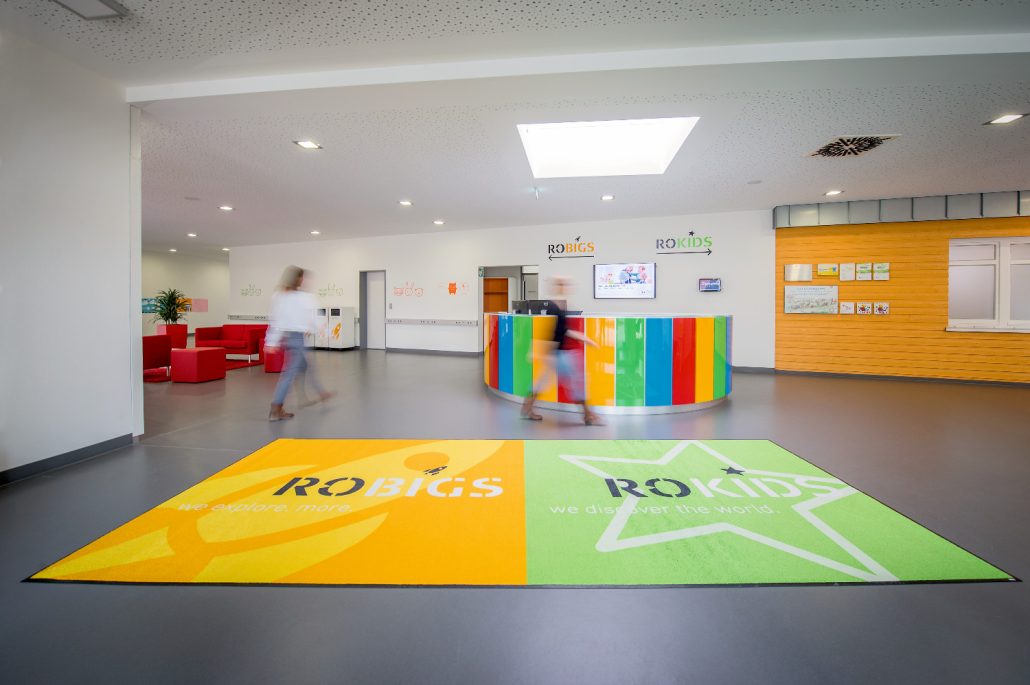 Colorful reception area with branding.